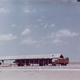 Preparing an R-5M missile for readiness test: rocket body under a tent
